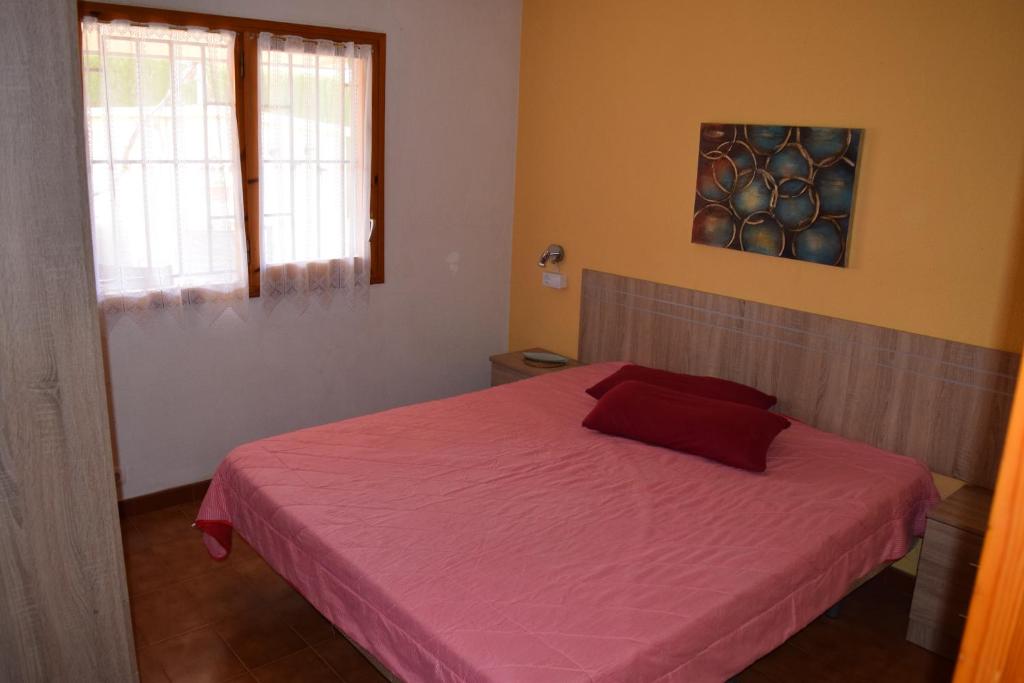 Postel nebo postele na pokoji v ubytování Casa L'Escala 30
