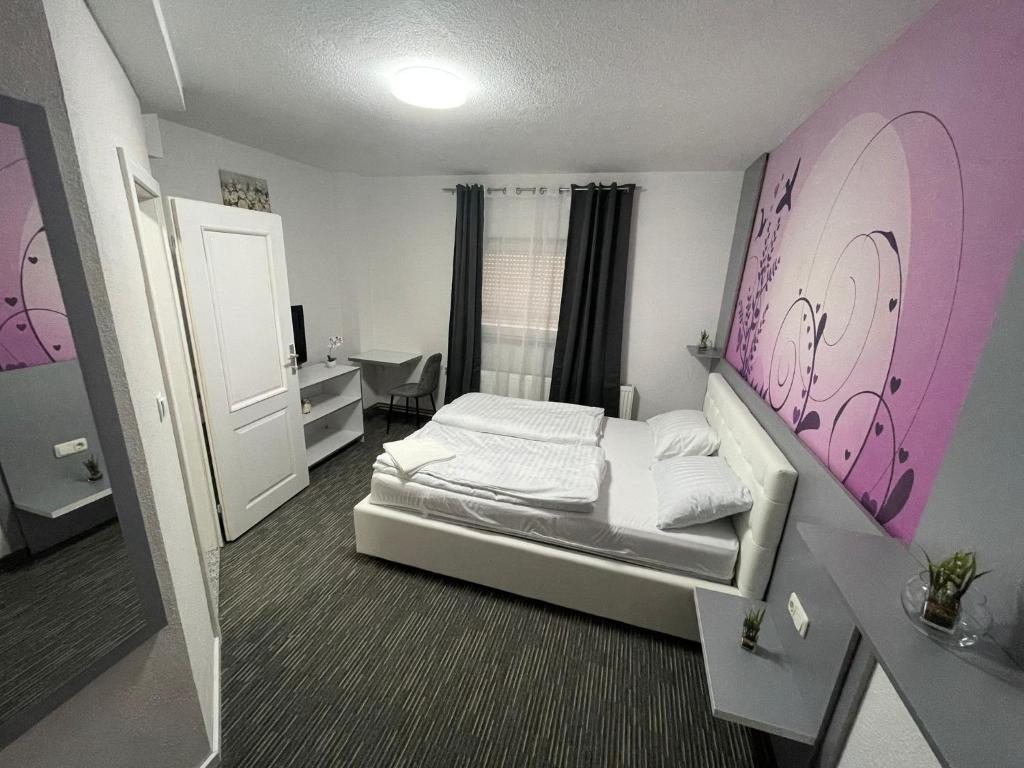 Ένα ή περισσότερα κρεβάτια σε δωμάτιο στο Apartman D&D