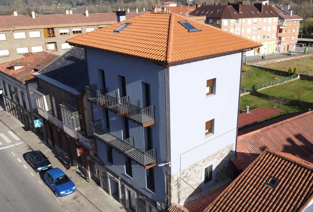 an overhead view of a building with an orange roof at Apartamentos Puerta de Occidente in Cornellana