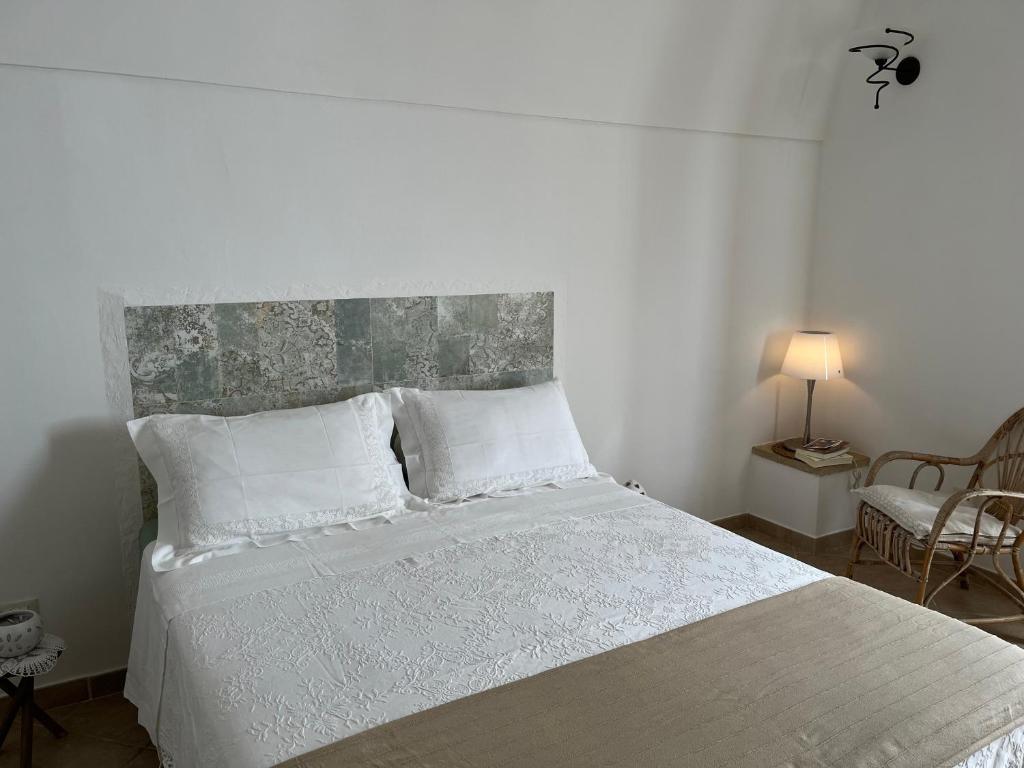 Postel nebo postele na pokoji v ubytování Corte degli Allori - Salento
