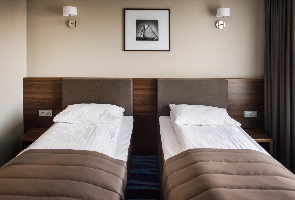 Postel nebo postele na pokoji v ubytování Hotel Porto