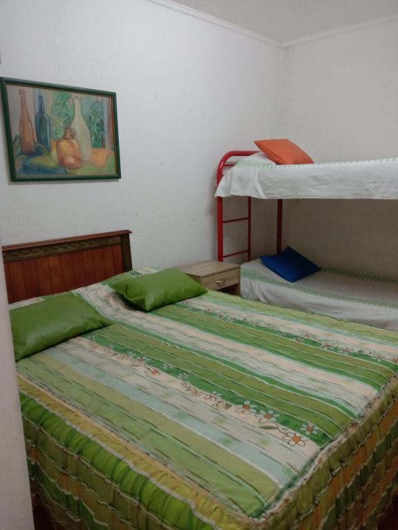 Postel nebo postele na pokoji v ubytování Hotel Capric