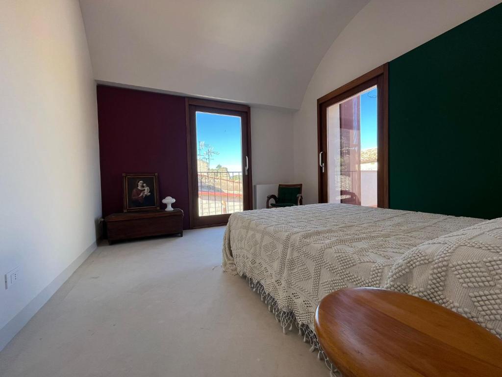 Postel nebo postele na pokoji v ubytování Palazzo Triolo - Dimora di Charme