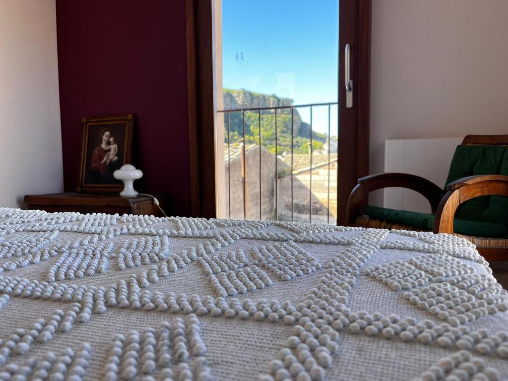 Postel nebo postele na pokoji v ubytování Palazzo Triolo - Dimora di Charme