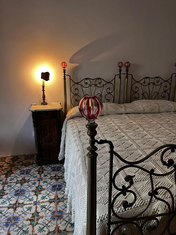 Postel nebo postele na pokoji v ubytování Palazzo Triolo - Dimora di Charme