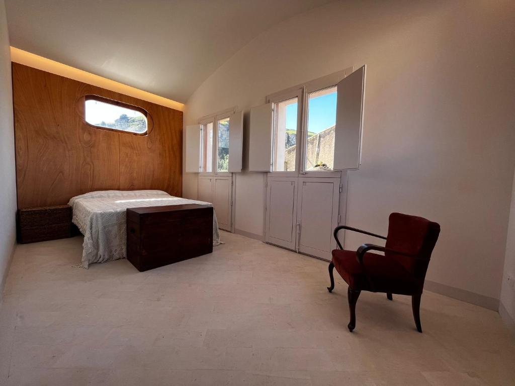 Postel nebo postele na pokoji v ubytování Palazzo Triolo - Dimora di Charme
