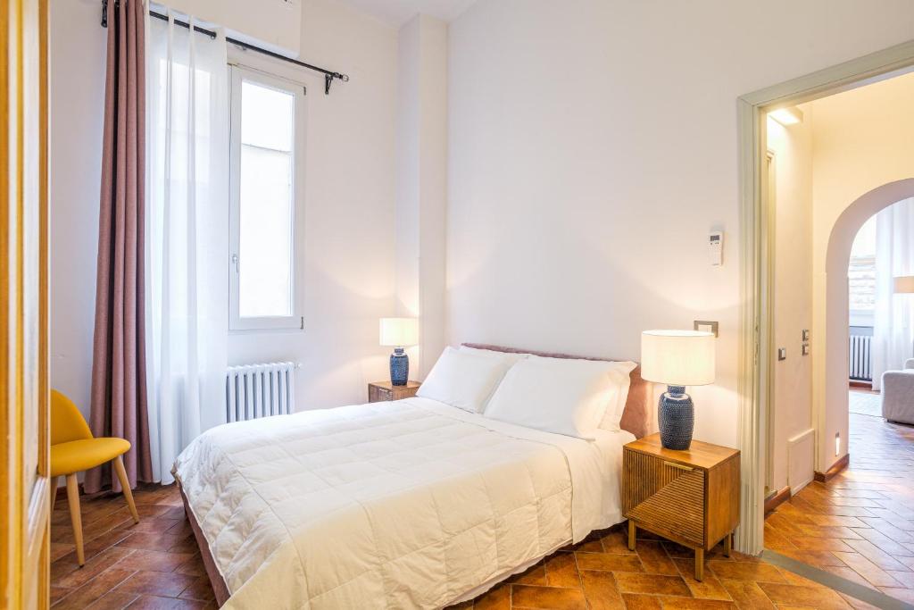 A bed or beds in a room at Condotta 16 Apartments