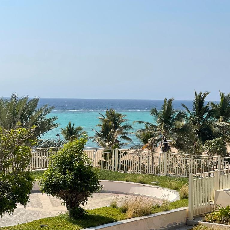a view of the beach from the balcony of a resort at شقة باطلاله بحريه - أبراج الشاطئ البيلسان Seafront Apartment in King Abdullah Economic City