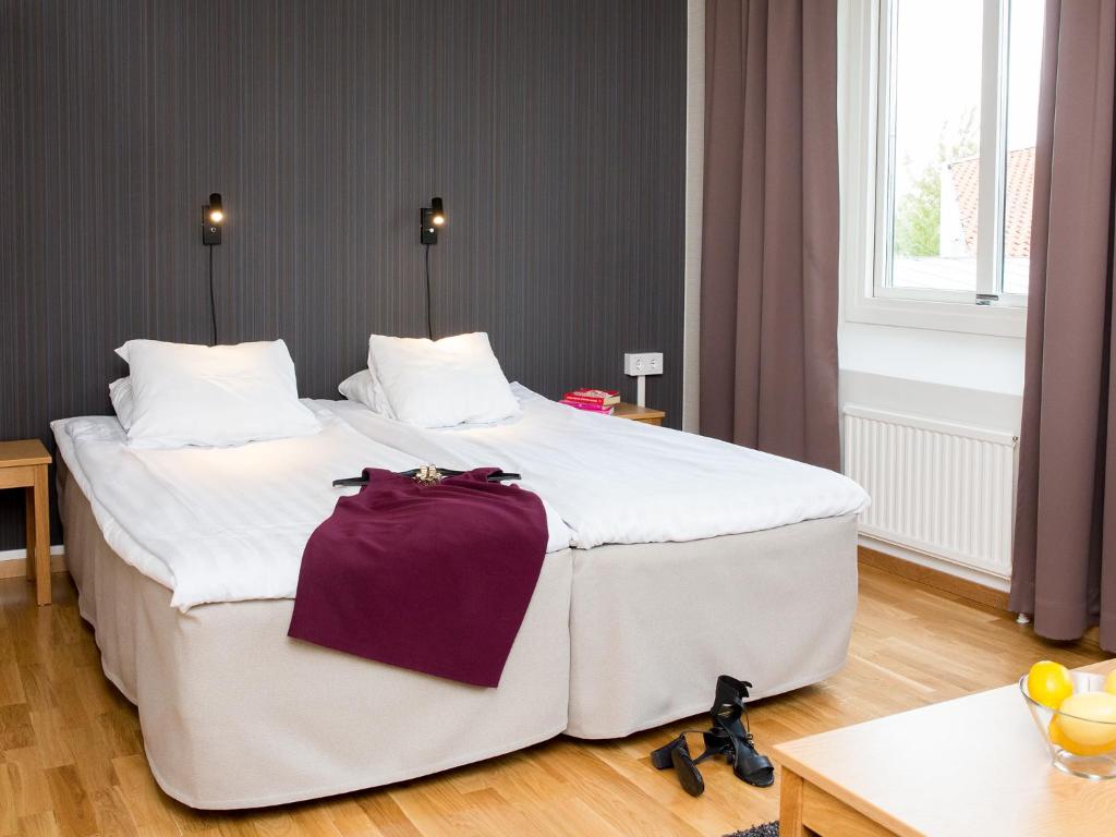 Postel nebo postele na pokoji v ubytování Hotell Svanen