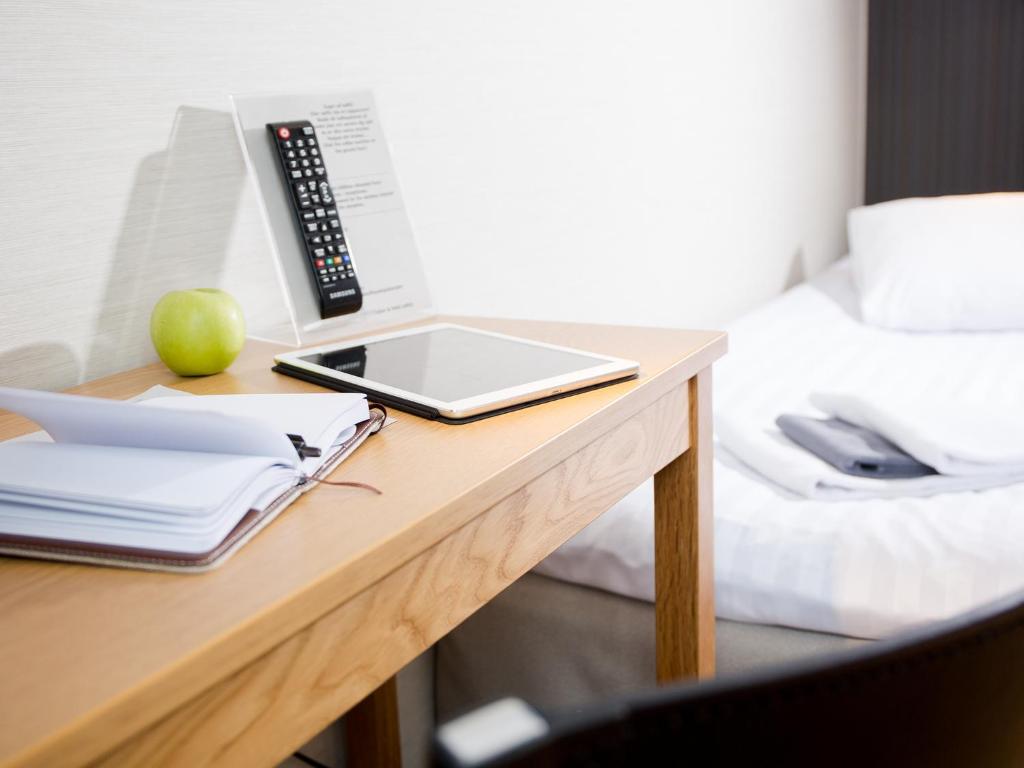 Postel nebo postele na pokoji v ubytování Hotell Svanen