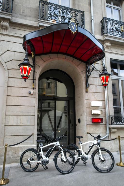 two bikes parked in front of a building at Vertigo Hotel, By Marriott, a Member of Design Hotels in Dijon