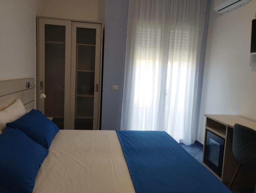 Postel nebo postele na pokoji v ubytování Hotel La Giara