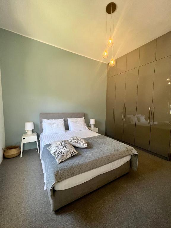 A bed or beds in a room at Villa 56 Luxury apartments