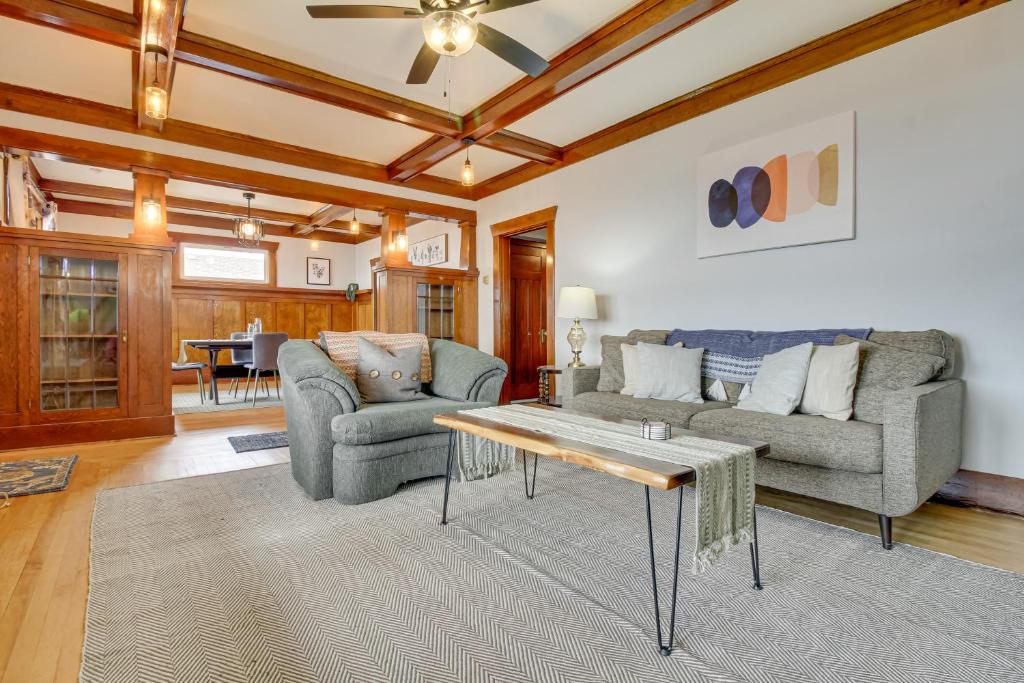 a living room with two couches and a coffee table at Classic Butte Vacation Rental with Mountain Views! in Butte