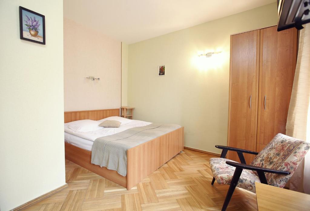 Postel nebo postele na pokoji v ubytování Silver Hotel