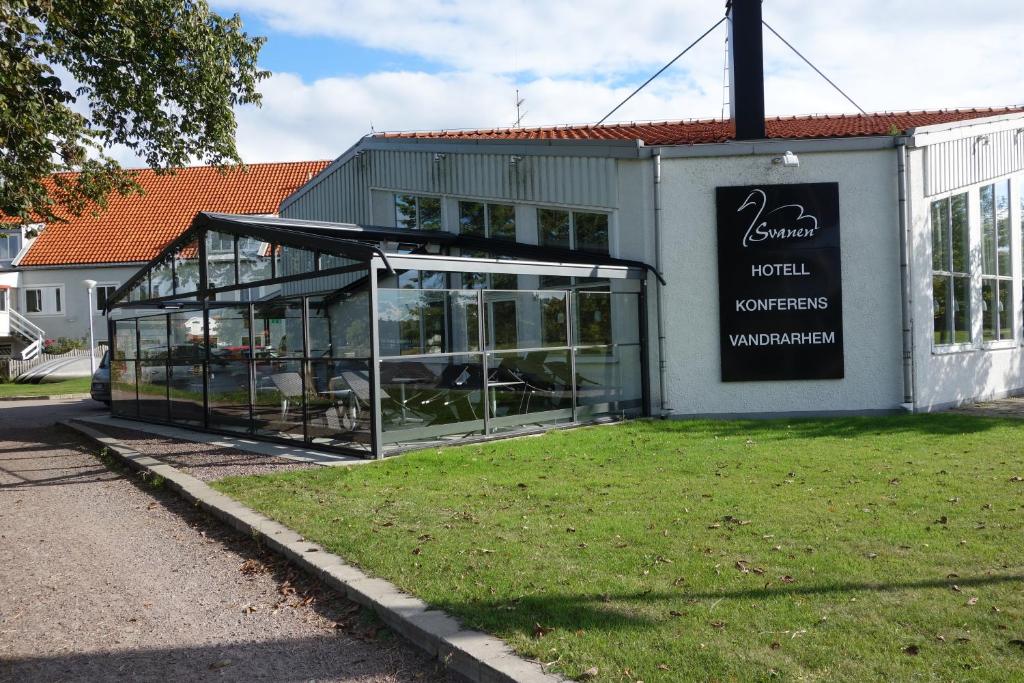 a building with a sign on the side of it at Vandrarhem Svanen in Kalmar