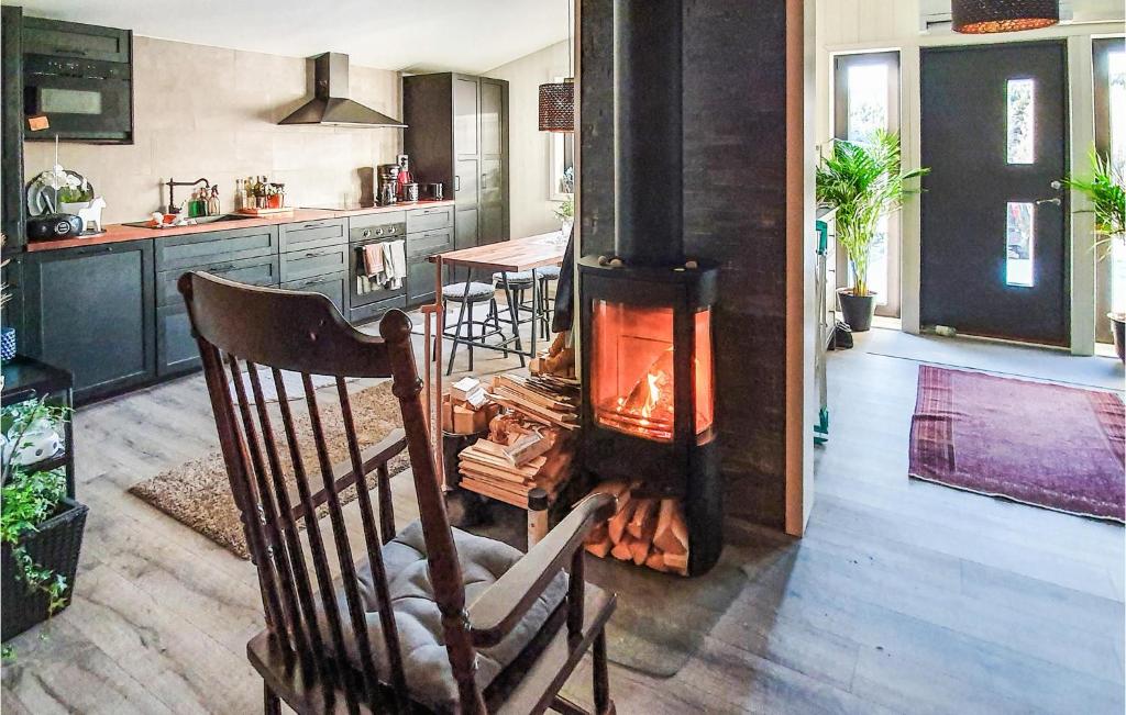 a kitchen with a woodburning stove in a room at Beautiful Home In Slen With 3 Bedrooms in Sälen