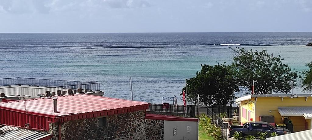 a view of the ocean from a building at DISTILLERIE in Tartane