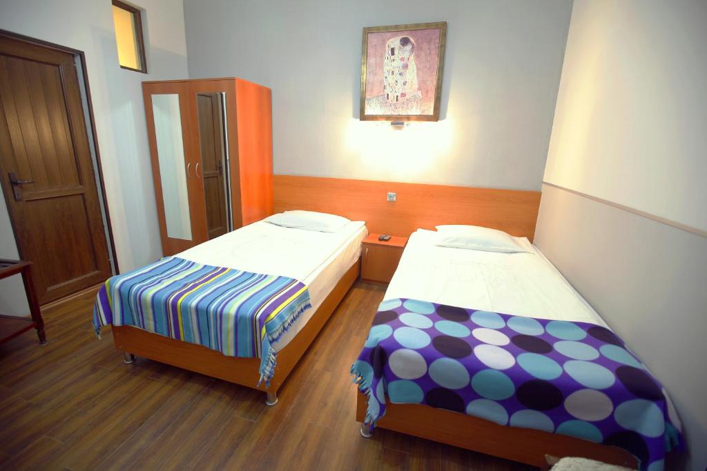 Postel nebo postele na pokoji v ubytování Silver Hotel