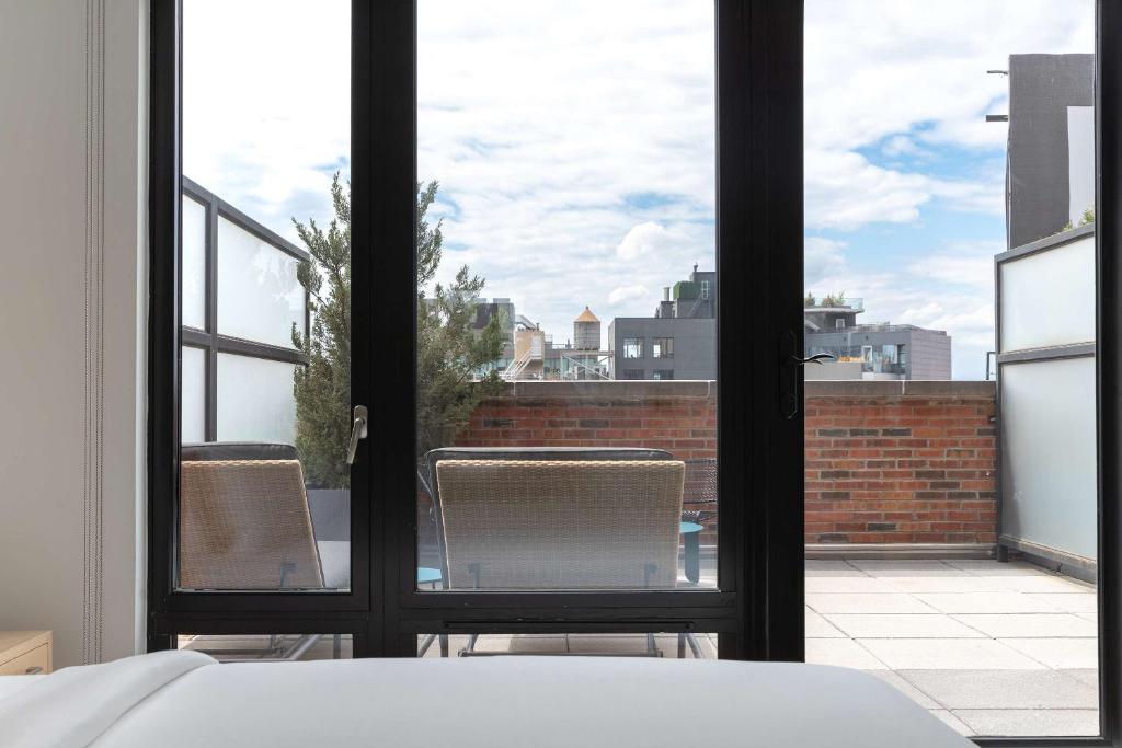 Cama ou camas em um quarto em Arlo SoHo