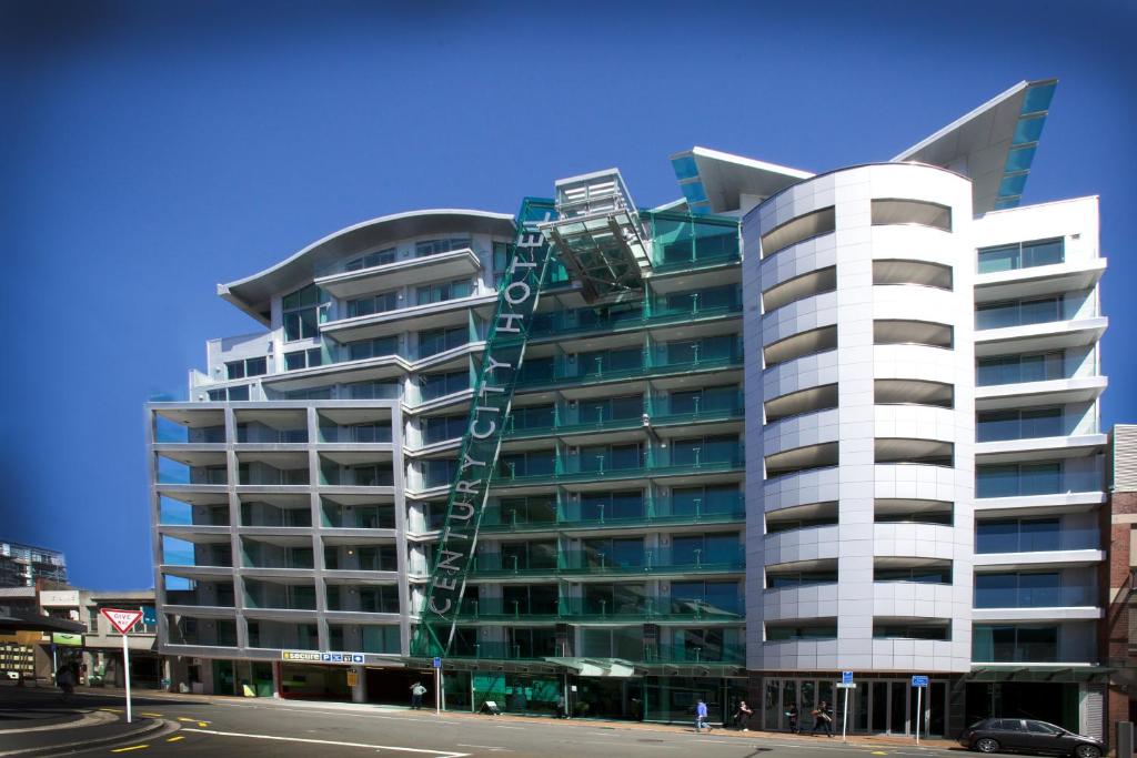 a tall white building with a spiral at Tory Hotel in Wellington