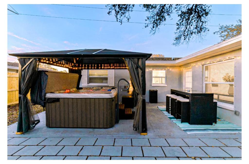 a gazebo on the patio of a house at A Wave From It All in Largo