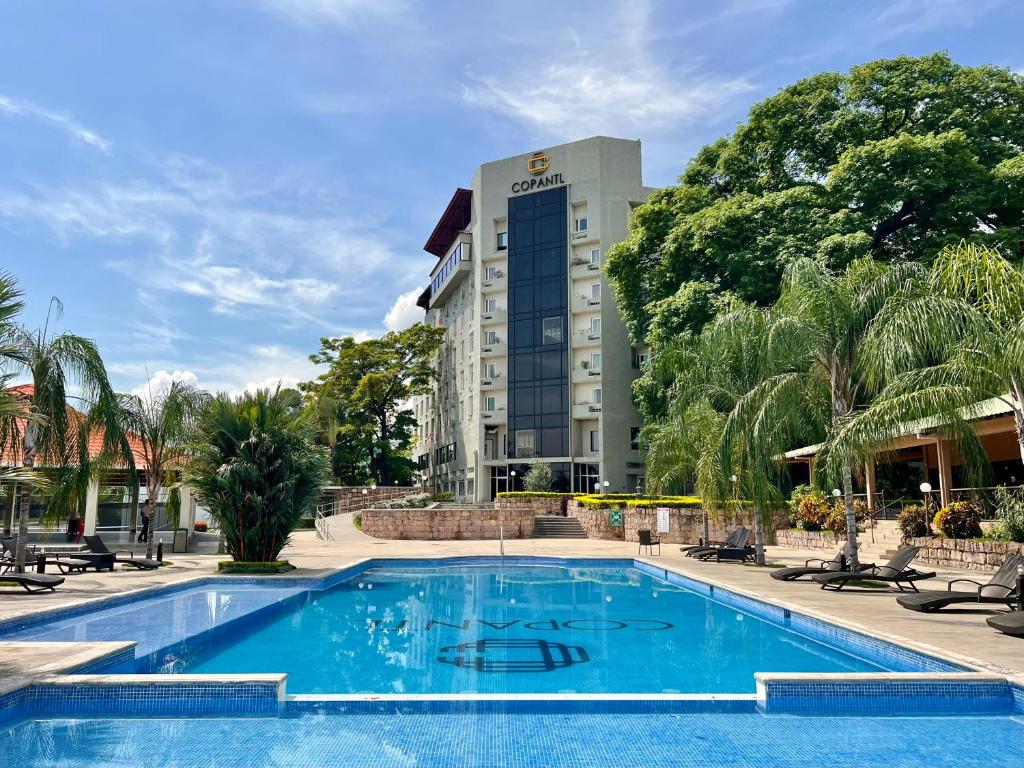 a swimming pool in front of a hotel at Copantl Hotel & Convention Center in San Pedro Sula