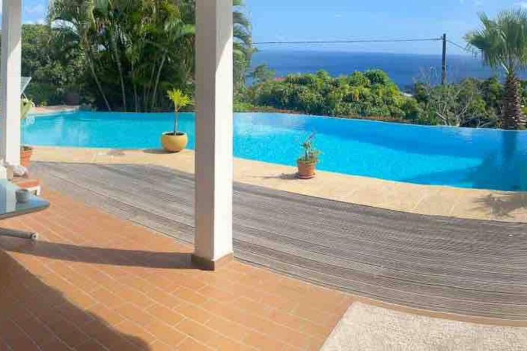 a view of a swimming pool from a house at YOU WELCOME VILLA in Case-Pilote