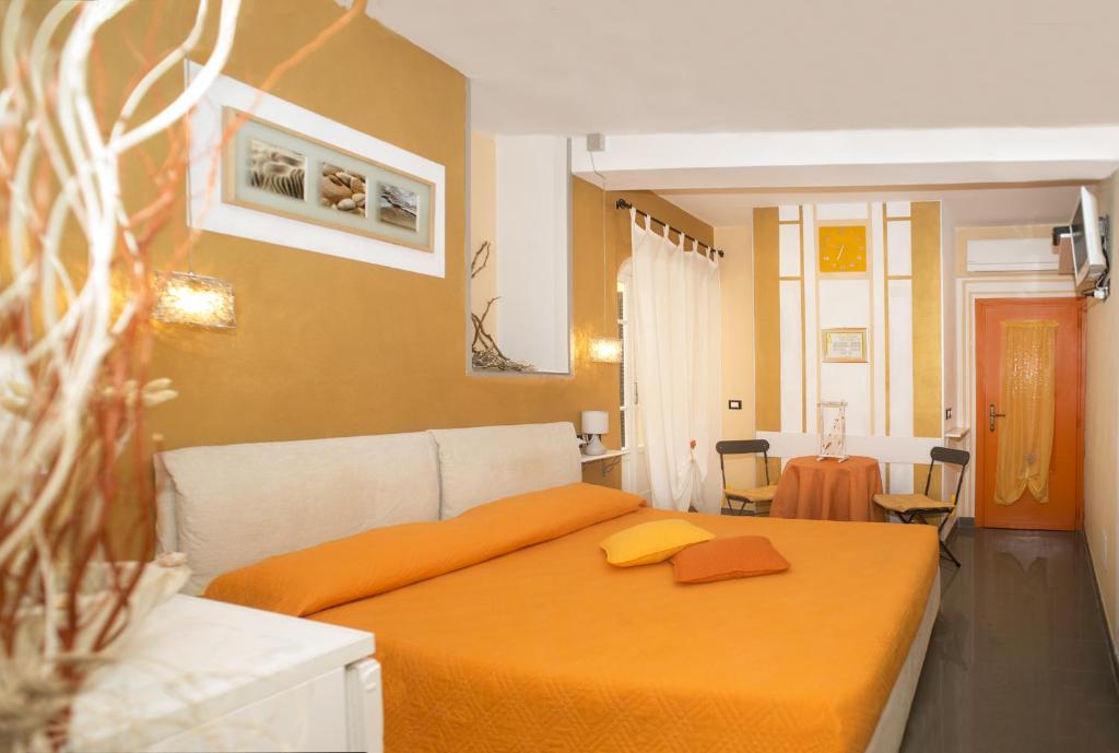 Postel nebo postele na pokoji v ubytování I Coralli rooms & apartments