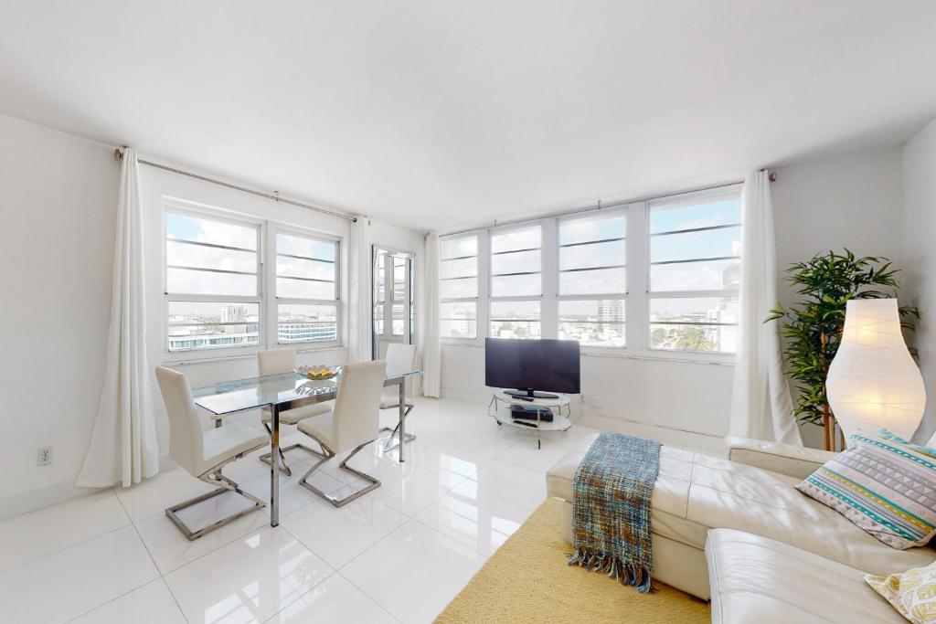 a living room with a couch and a table at Decoplage Paradise - Unit B in Miami Beach