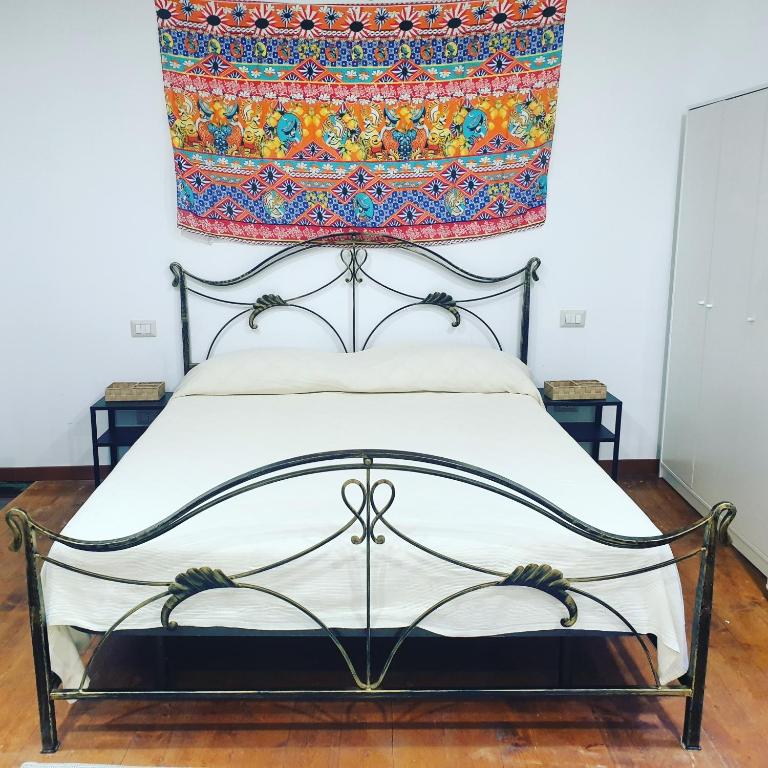 A bed or beds in a room at Sicily House Soprano