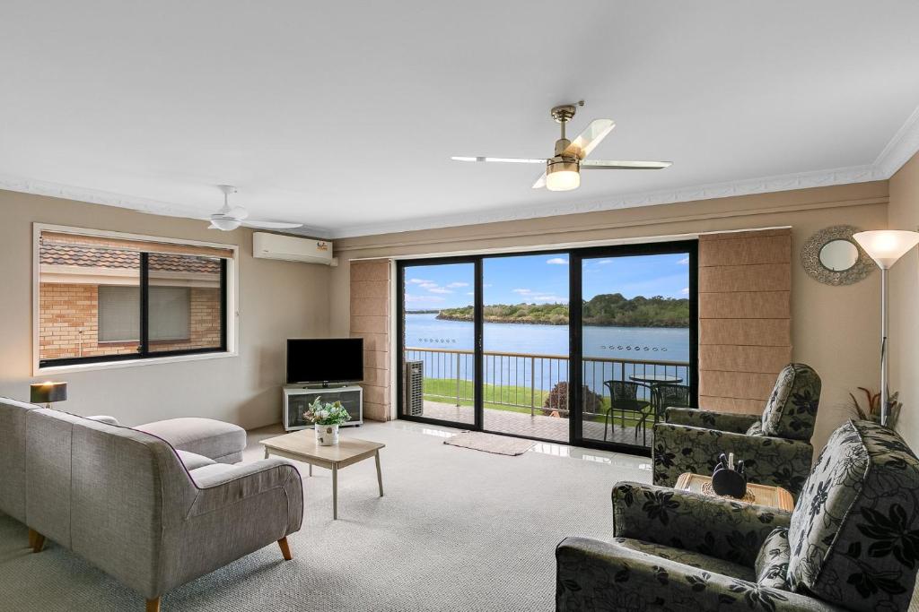 a living room with a view of the water at Unit 7 18 Endeavour Parade in Tweed Heads