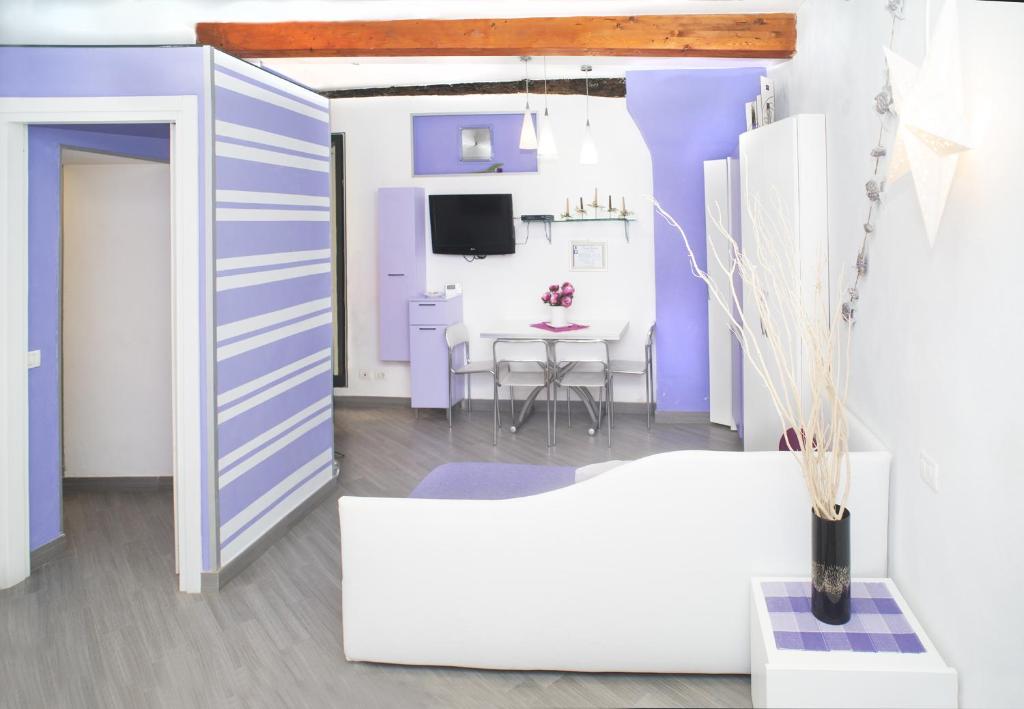 TV a/nebo společenská místnost v ubytování I Coralli rooms & apartments
