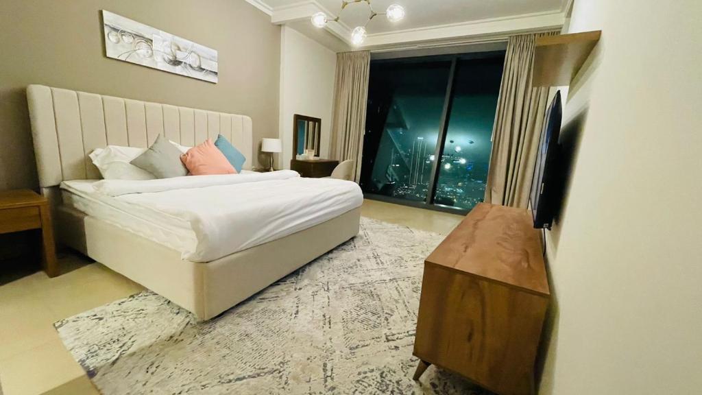 En eller flere senger på et rom på Burj Vista Tower 1