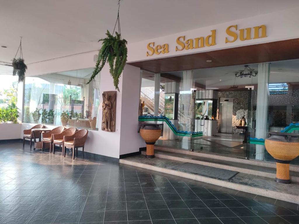 a view of a ssea sand sun mall with chairs and tables at Sea sand sun resort Deluxe Mae Rumphueng beach in Ban Chak Phai