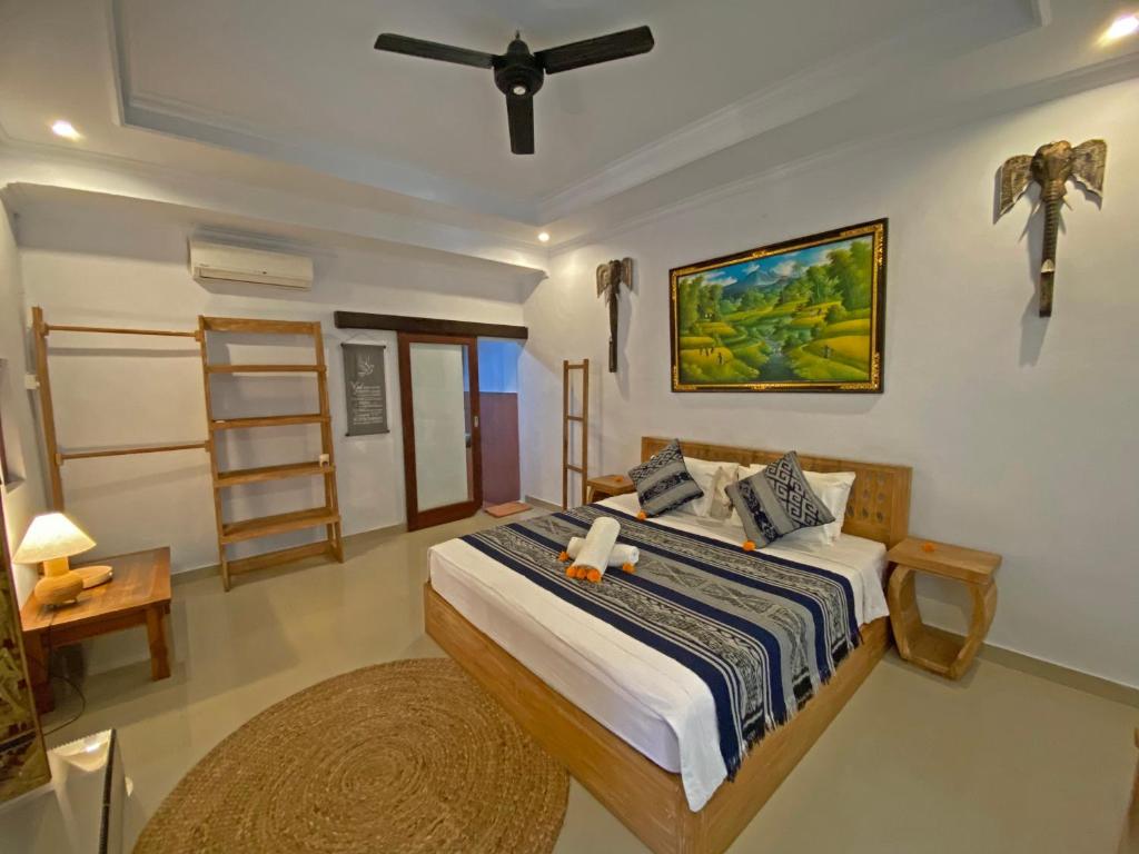 Postel nebo postele na pokoji v ubytování Ganesh Room