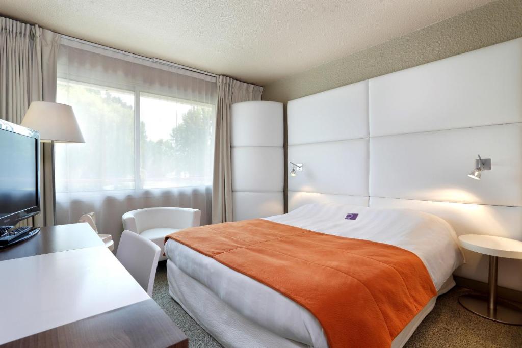 Postel nebo postele na pokoji v ubytování Mercure Brive