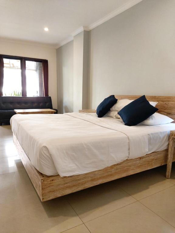 Postel nebo postele na pokoji v ubytování Radha Bali Hotel