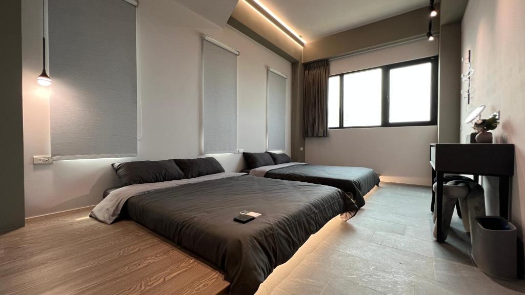 Postel nebo postele na pokoji v ubytování 沒有名字Unnamed B&B