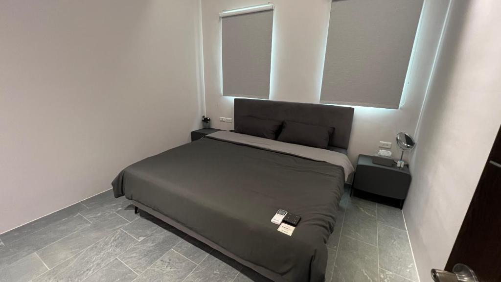 Postel nebo postele na pokoji v ubytování 沒有名字Unnamed B&B