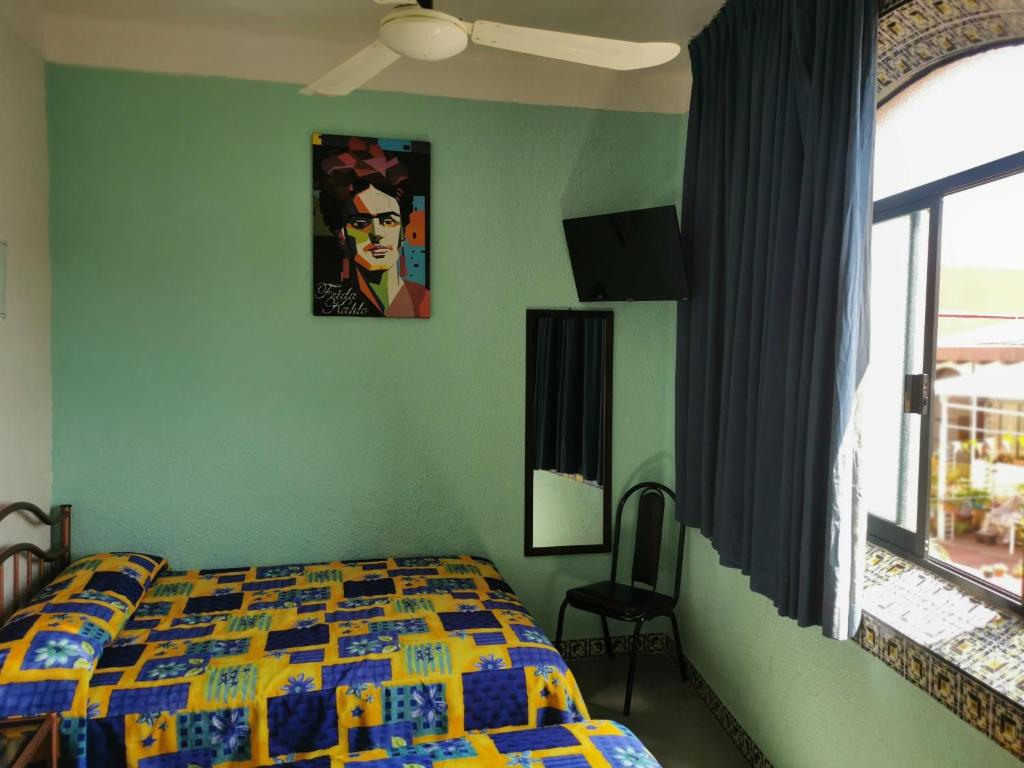 Postel nebo postele na pokoji v ubytování HOTEL LIMÓN