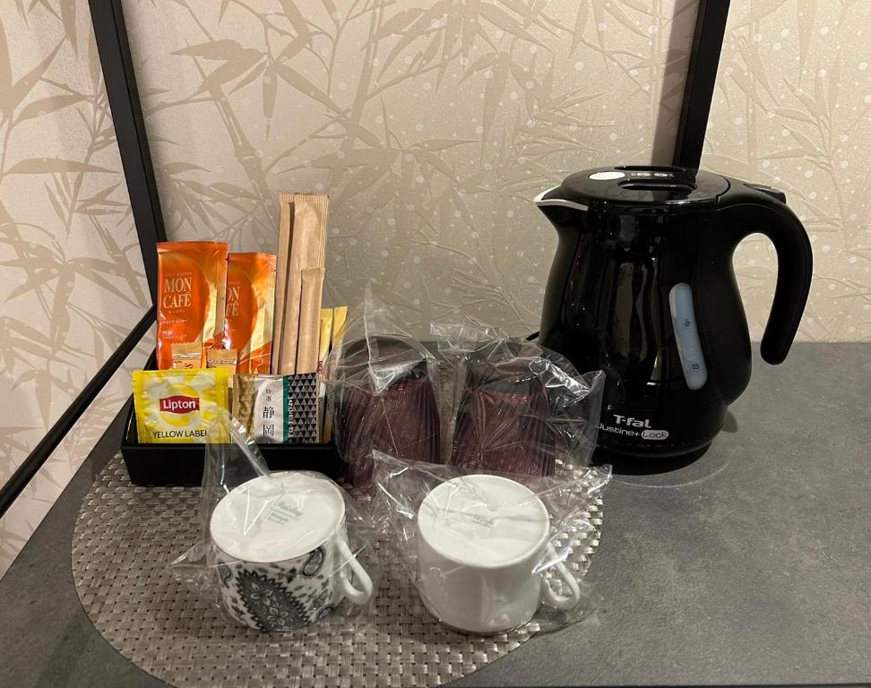 Příslušenství pro přípravu čaje a kávy v ubytování Hotel Kaguya