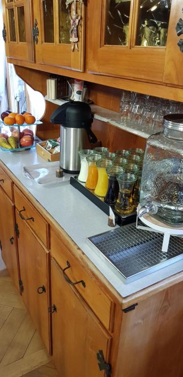 a kitchen with a counter top with food on it at Gasthof Schoenegg B&B in Goldswil