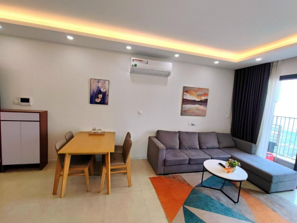 a living room with a couch and a table at Linh Homestay in Hanoi