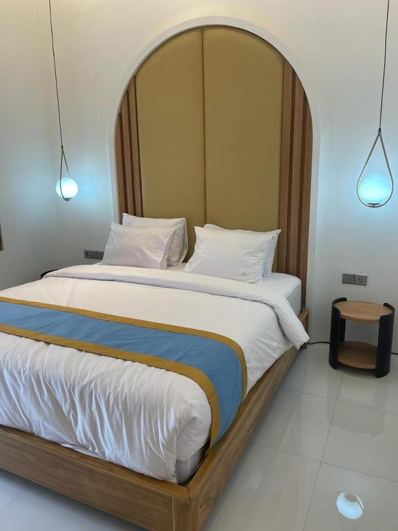 Postel nebo postele na pokoji v ubytování Hotel Besar Purwokerto
