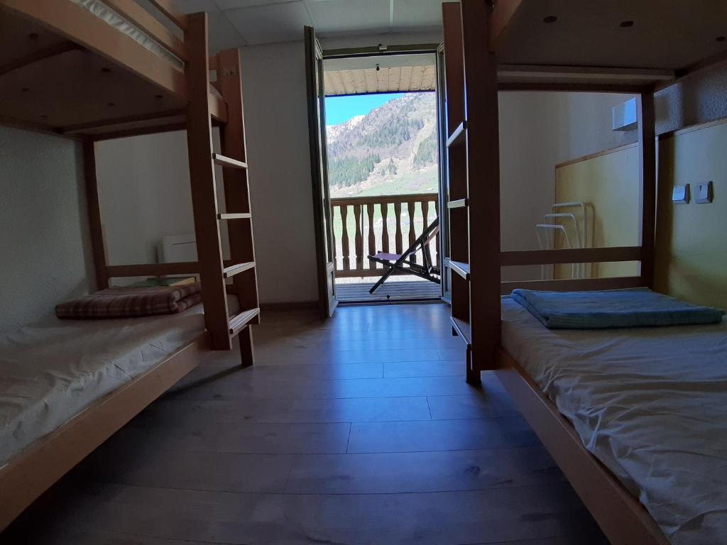 Postel nebo postele na pokoji v ubytování Centre de Vacances Le Hameau Rollot