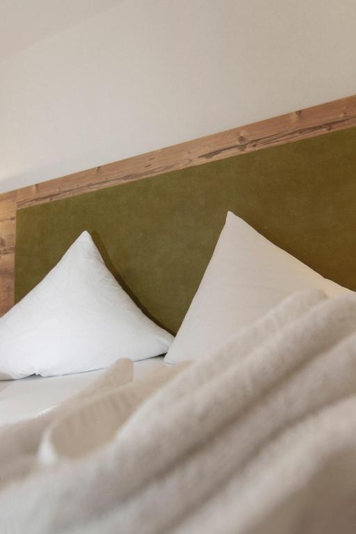 Postel nebo postele na pokoji v ubytování Hotel Neuwirt