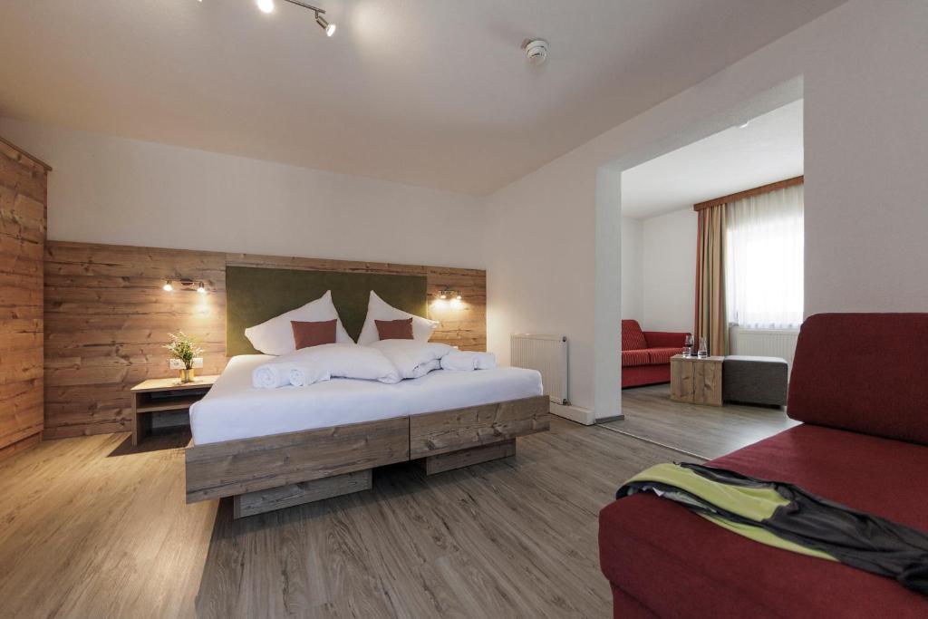 Postel nebo postele na pokoji v ubytování Hotel Neuwirt