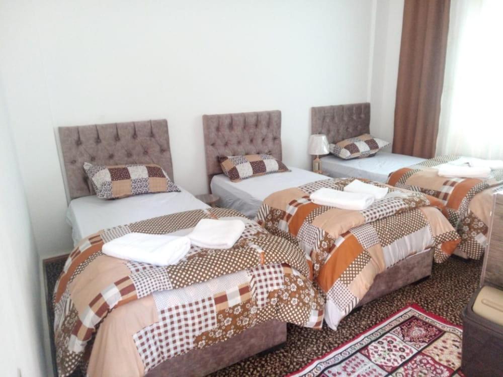 Postel nebo postele na pokoji v ubytování taila hostel