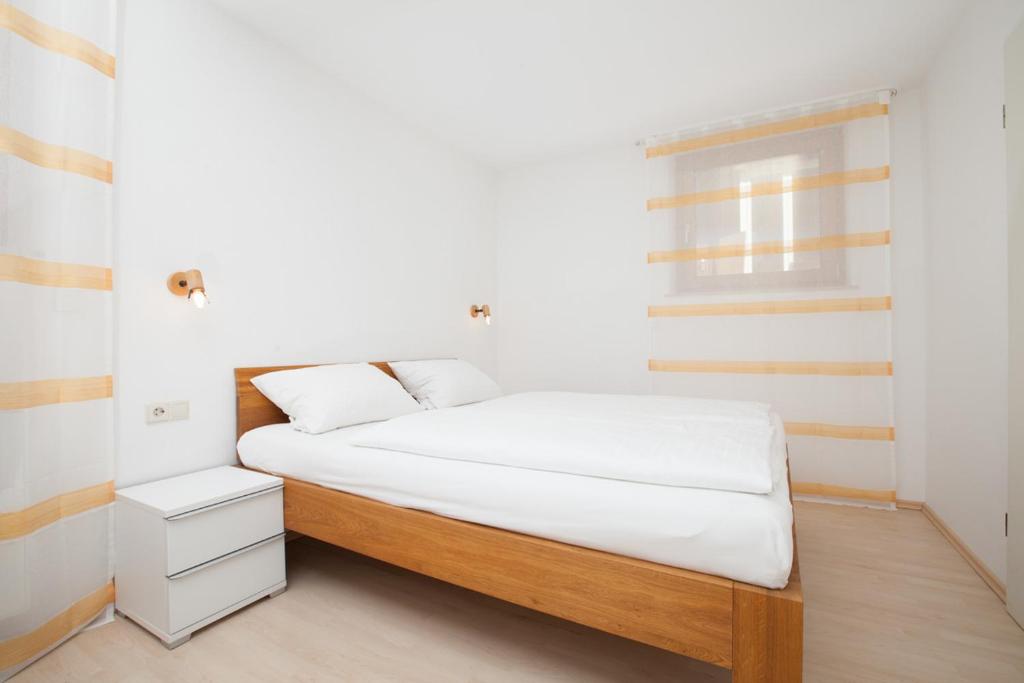 Postel nebo postele na pokoji v ubytování Gästehaus Schechter